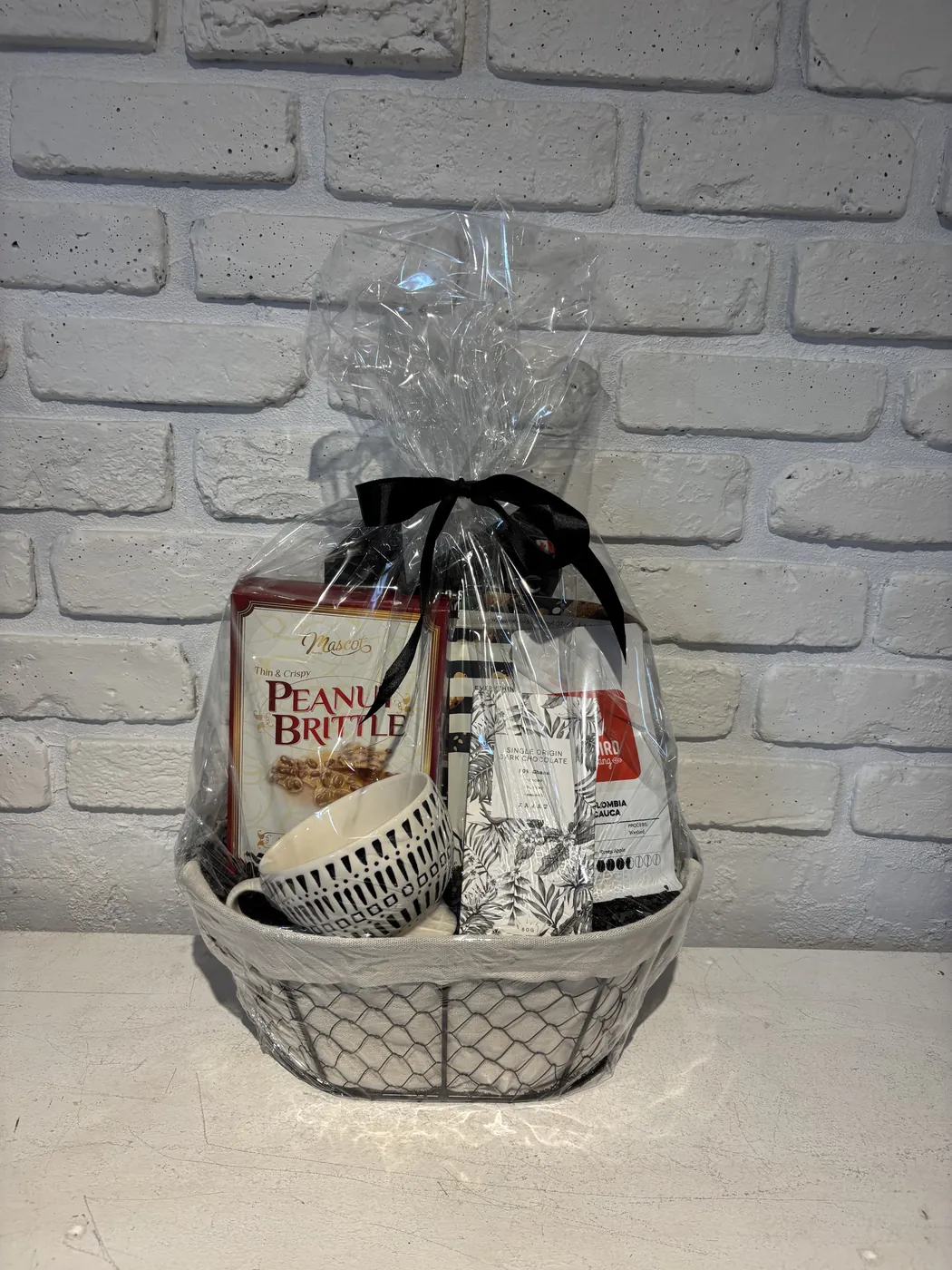 Redbird coffee gift basket with peanut brittle, a ceramic mug and dark chocolate