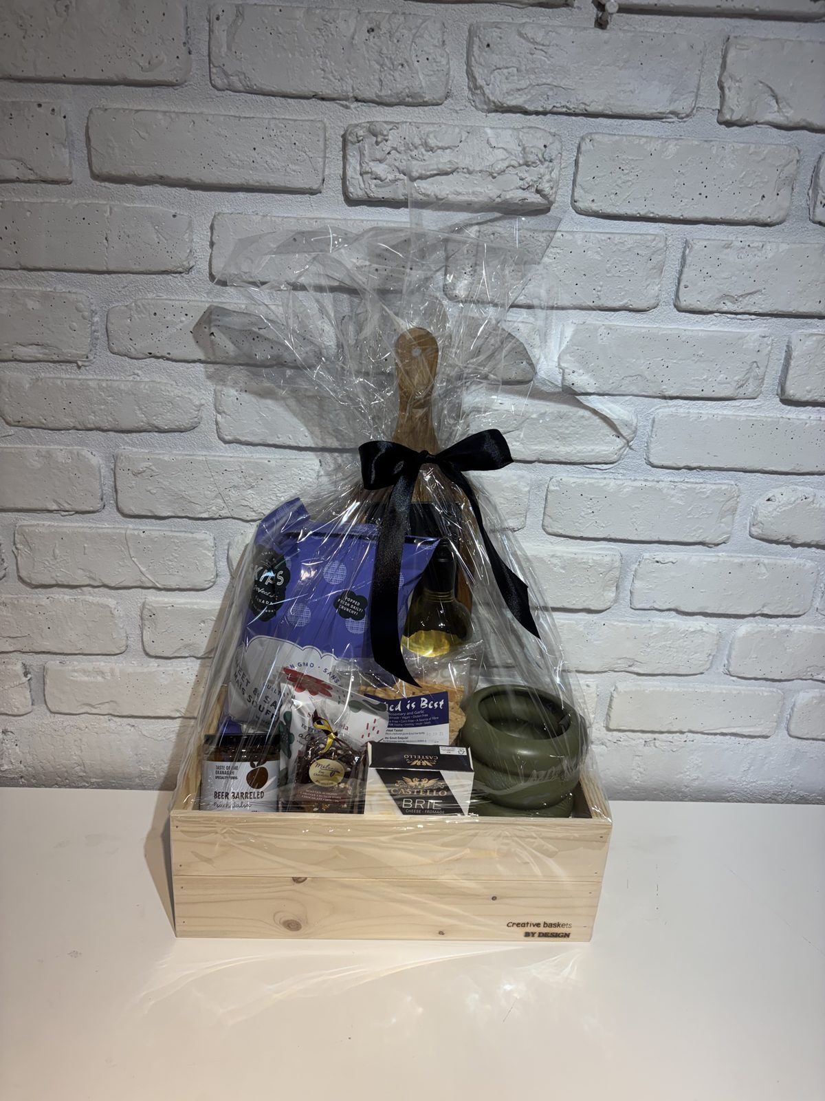 Wooden box gift basket with serving board, white wine and Okanagan treats
