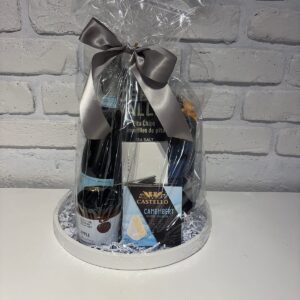 La Marca Prosecco gift set on a white serving tray with Castello Camembert, apple chutney and Cedar Valley pita chips
