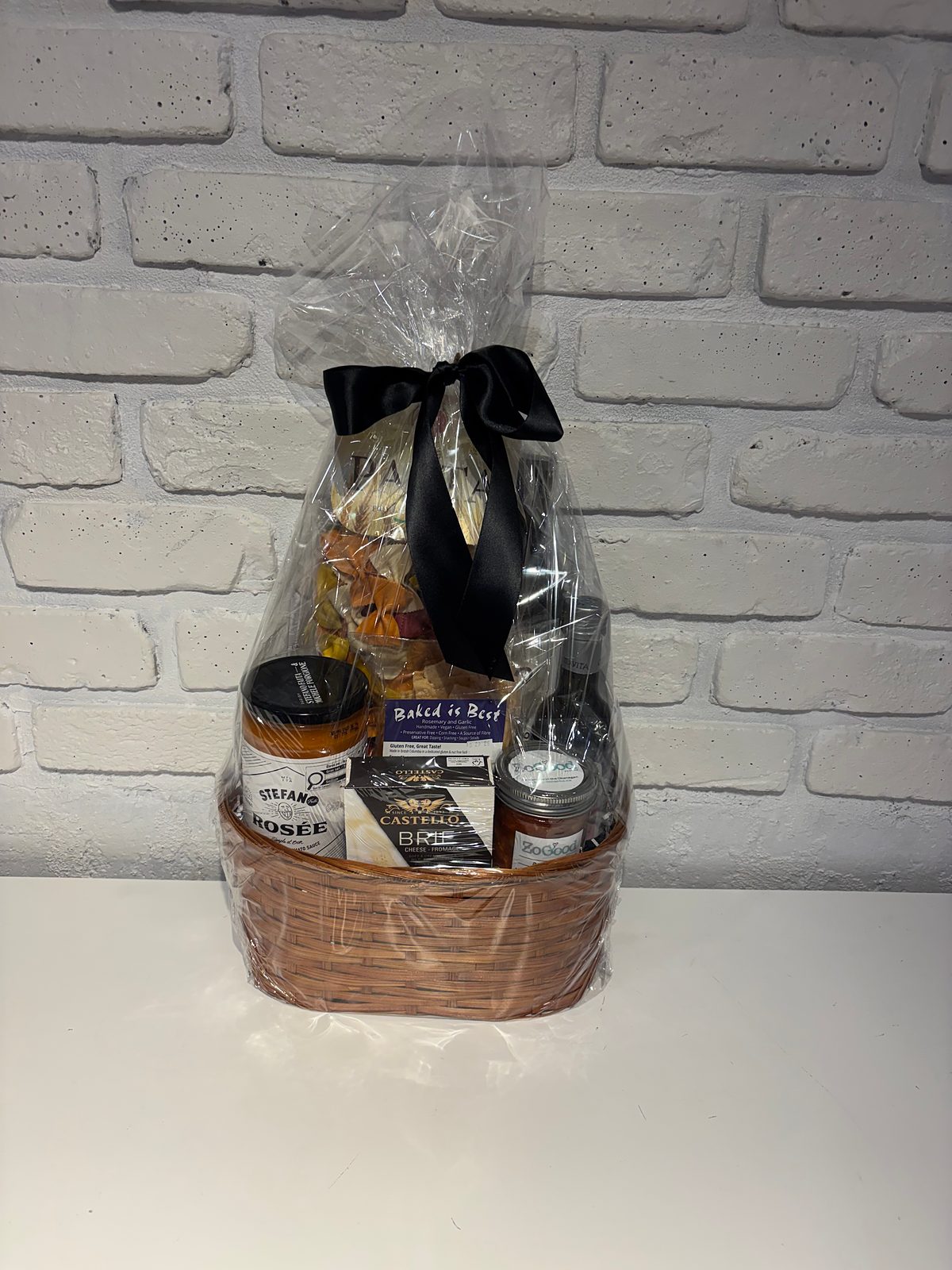 Pasta Lovers gift basket with Stefano Rosée pasta sauce, pasta bows, Castello brie, Baked is Best crackers and red wine