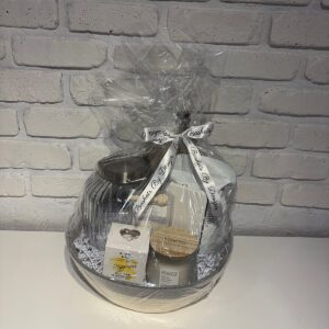 Relax and Unwind spa gift basket with a glass storage jar, bath bomb, shower steamers, candle and face mask