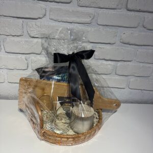 Sip and Savour gift basket with a wooden serving board, two wine glasses, Castello brie, Riceworks chips and a candle